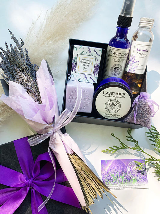 Large purple gift set for women from NZ lavender farm featuring essential oils scented hand cream, dried flowers, handmade soap, body oil, sleep spray, chamomile herbal tea and wardrobe sachet.