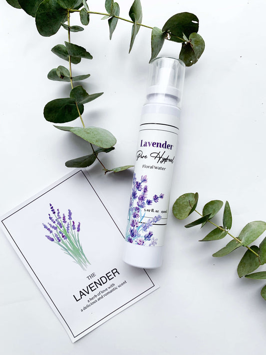 Natural face toner with lavender flower water, decorated with eucalyptus leaves and a lavender greeting card in the background.