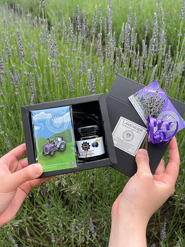 Delightful New Zealand Farm Souvenir Gift Set containing tractor badge and blueberry jam from NZ lavender farm