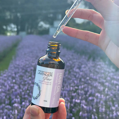 Open lavender hair oil bottle showing the lightweight oil texture.