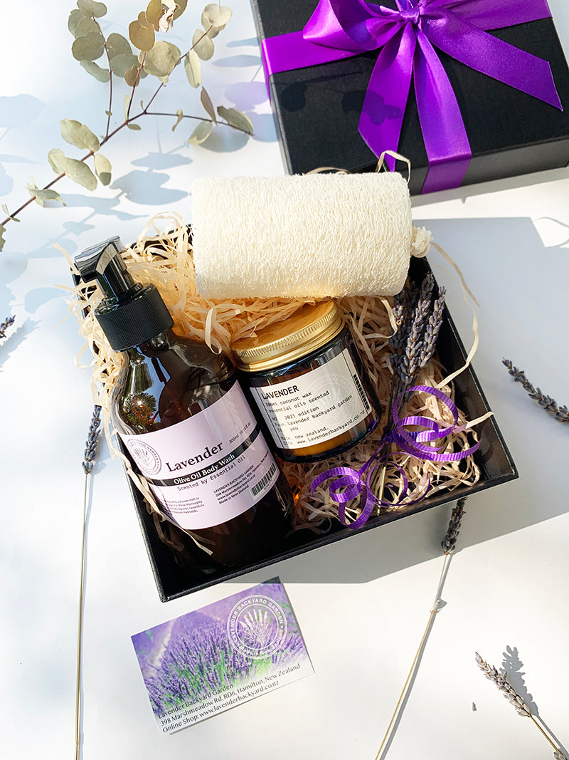 Showertime Pamper Gift Hamper featuring coconut candle and body wash scented by essential oils with mini lavender dried flowers from NZ lavender farm